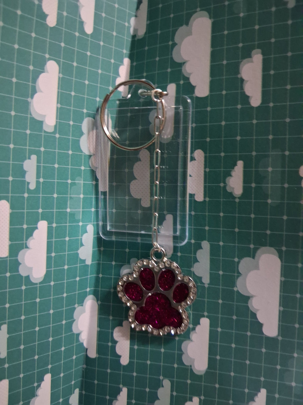 Red glitter resin paw keyring with silver-coloured chain and clear acrylic photo frame