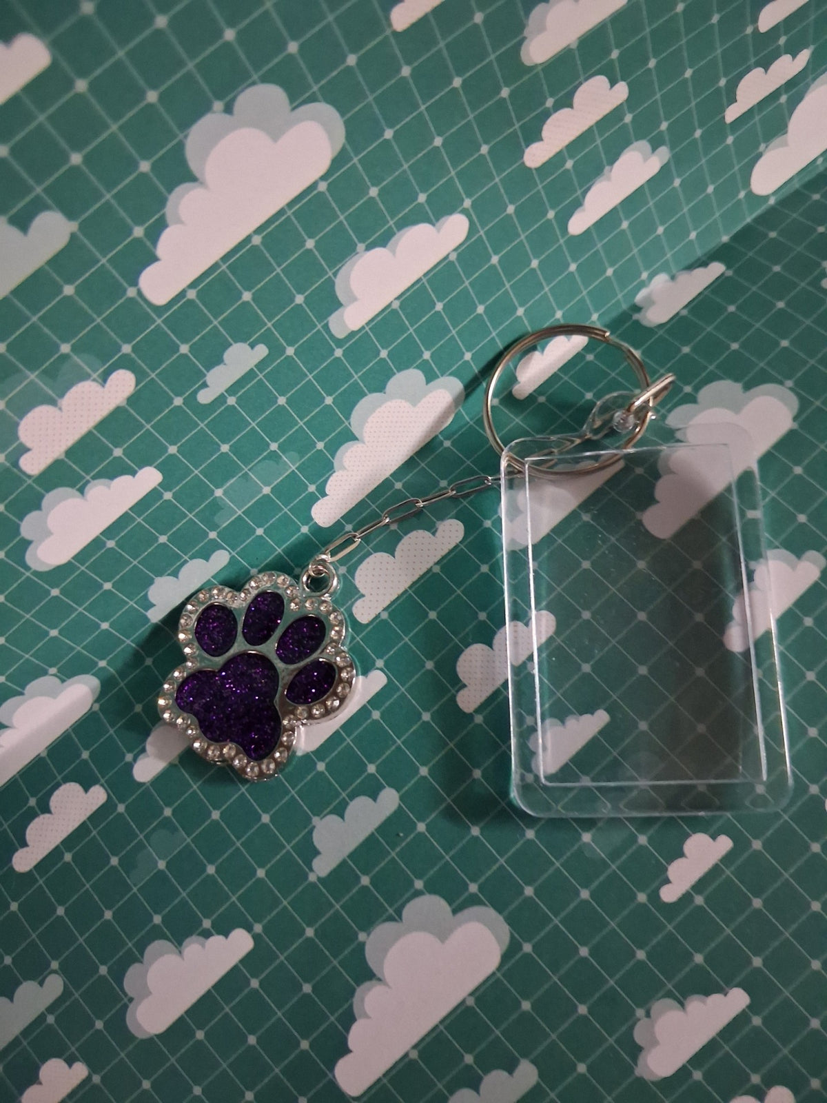 Purple glitter resin paw keyring with silver-coloured chain and clear acrylic photo frame